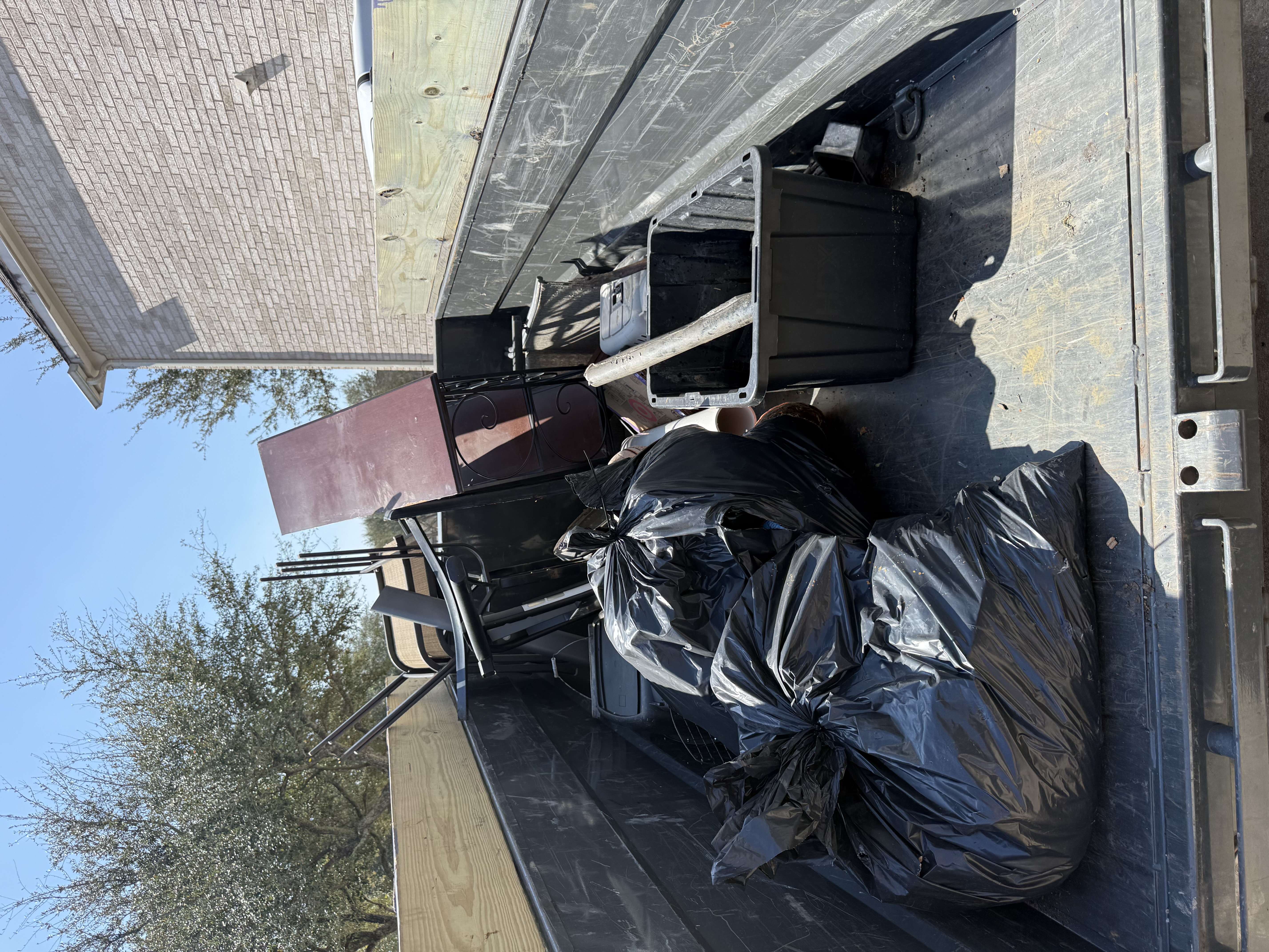 Furniture and junk removal — loaded trailer